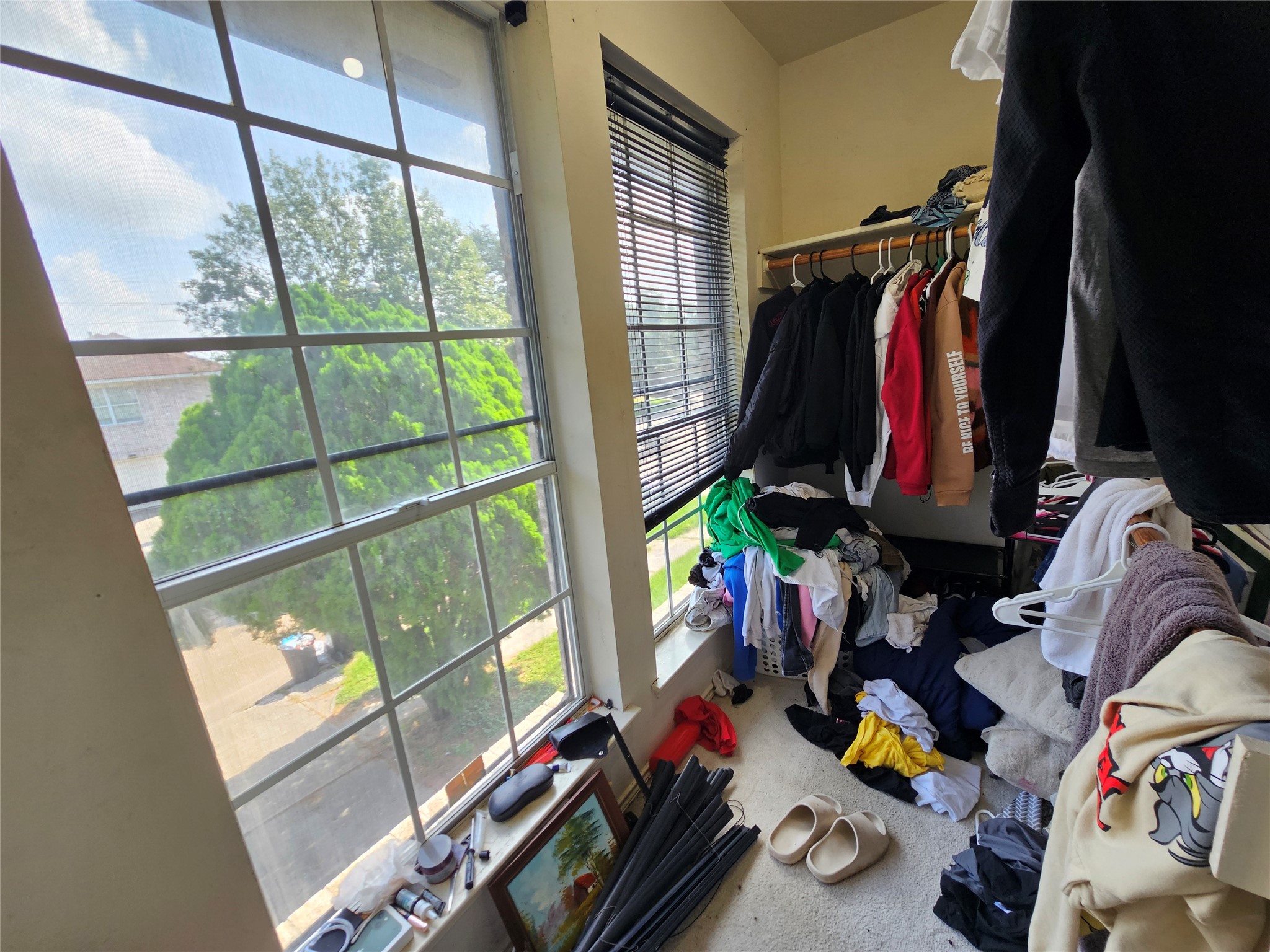 13615 Repa Lane Houston, TX 77014 - Photo 29 of 30 a view of walk in closet with clothes and shoes