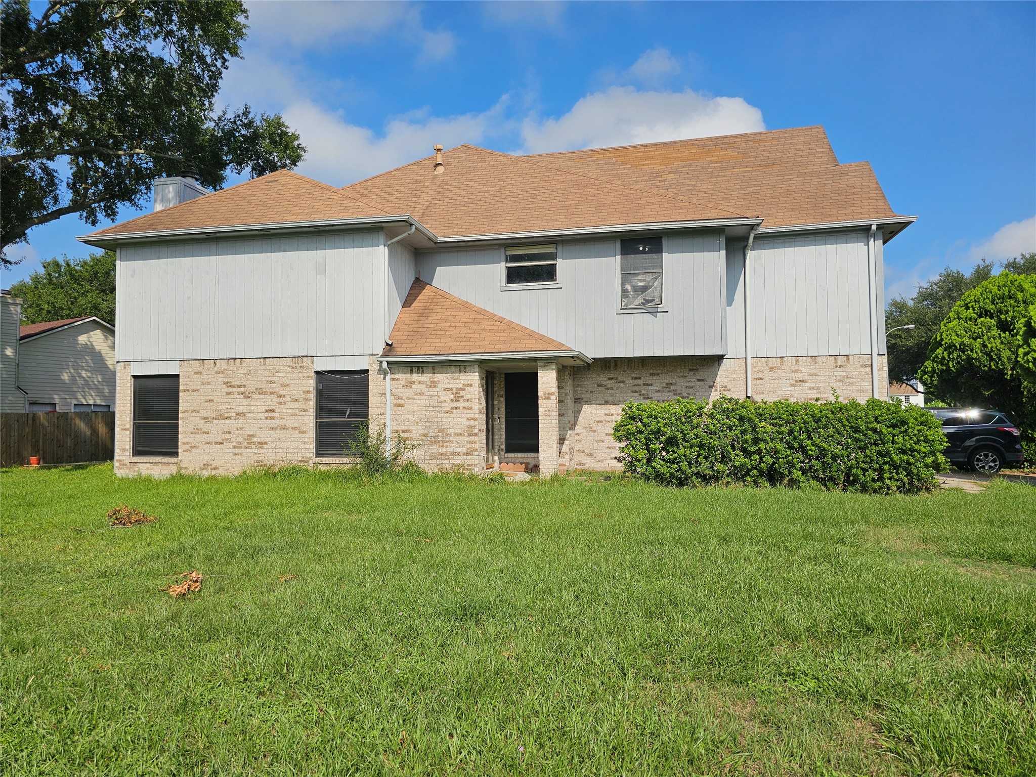 13615 Repa Lane Houston, TX 77014 - Photo 4 of 30 a front view of a house with a yard and garage
