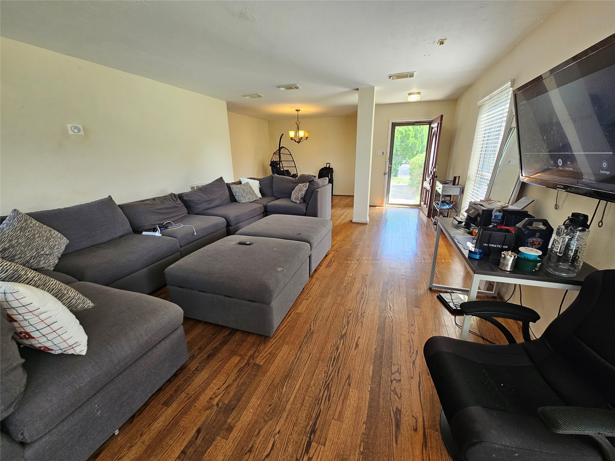 13615 Repa Lane Houston, TX 77014 - Photo 8 of 30 a living room with furniture and a flat screen tv