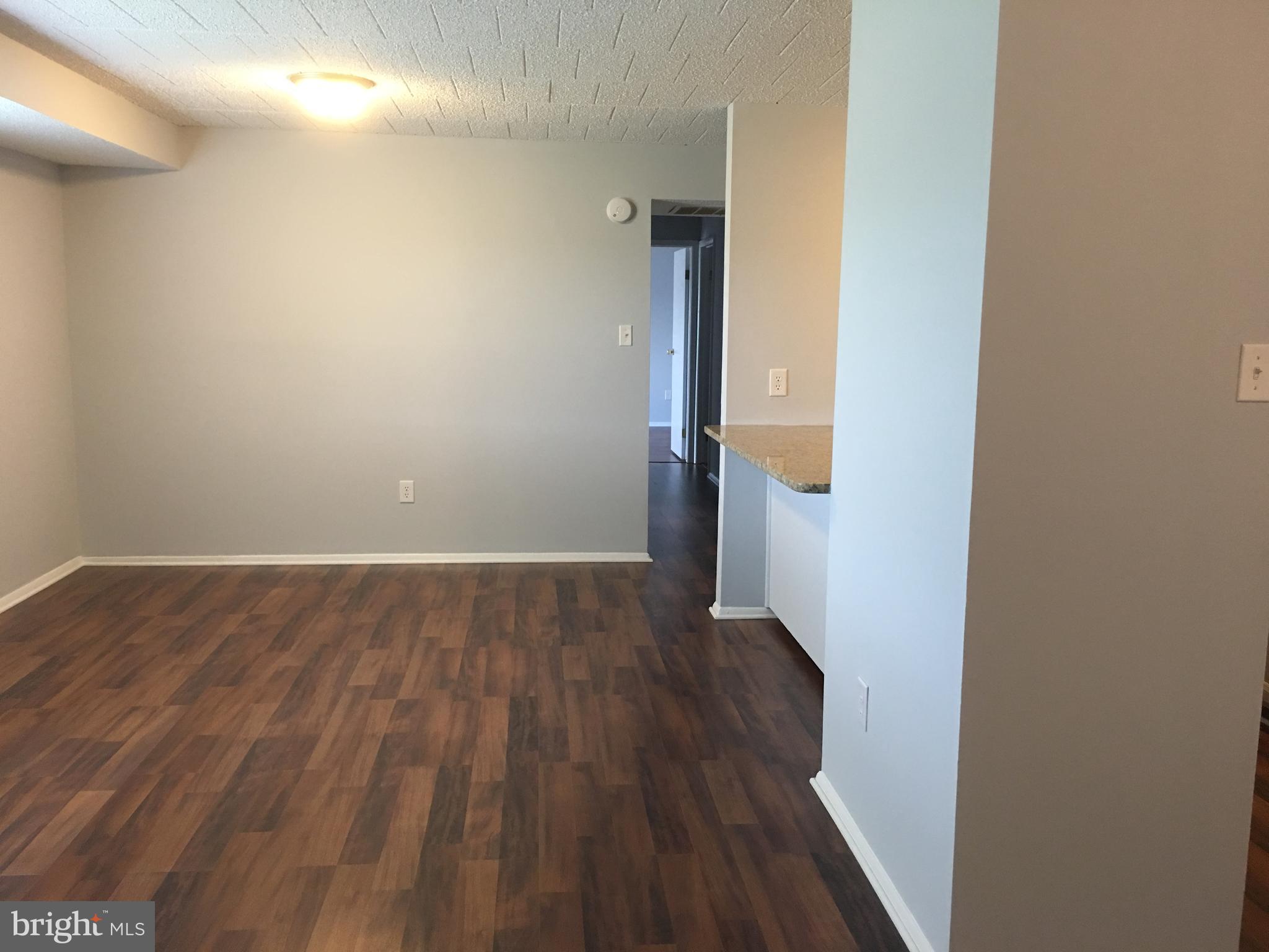 997 Heather Ridge Drive, Unit C Frederick, MD 21702 - Photo 7 of 14 Living room with new flooring