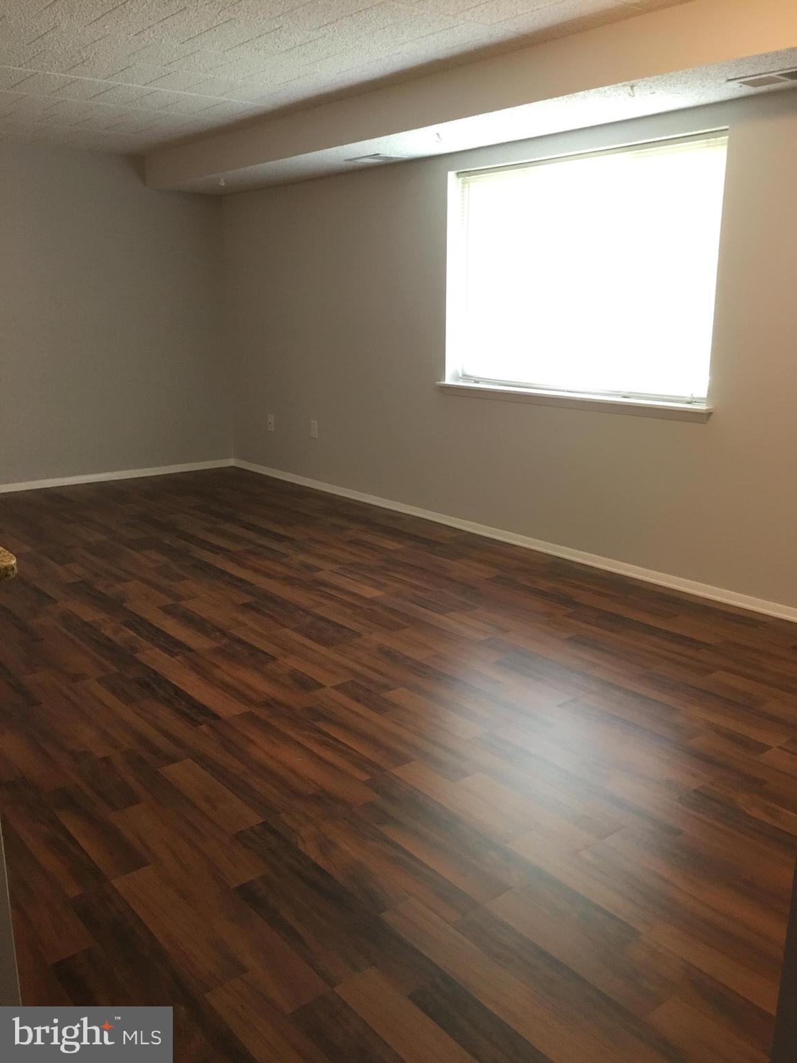 997 Heather Ridge Drive, Unit C Frederick, MD 21702 - Photo 8 of 14 living room with new flooring view 2