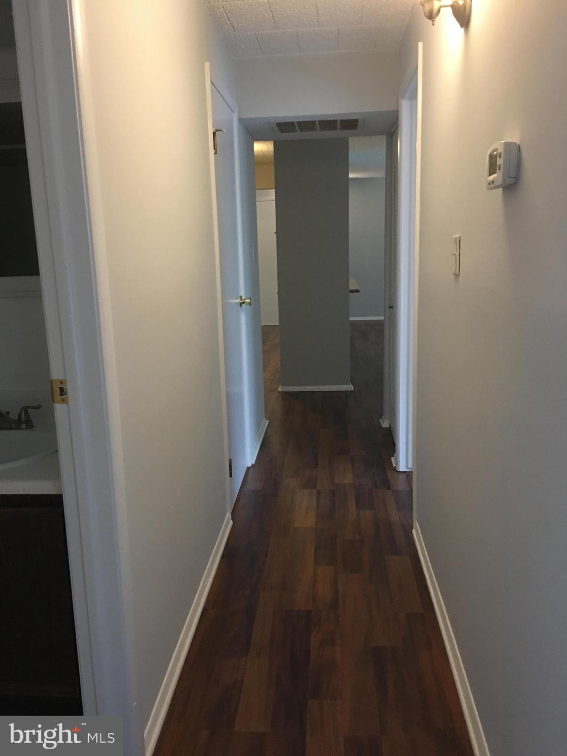 997 Heather Ridge Drive, Unit C Frederick, MD 21702 - Photo 9 of 14 Hallway leading to bedroom, laundry and bathroom