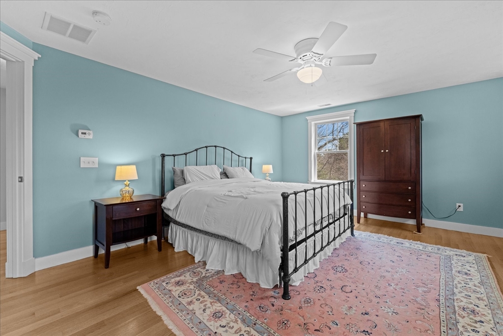 50 Quabbin Path Sutton, MA 01590 - Photo 23 of 42 a bedroom with a bed and a table