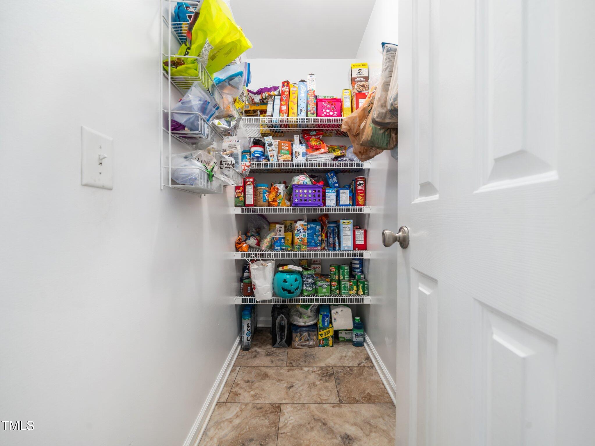 3690 Mabel Lane Stem, NC 27581 - Photo 13 of 37 a room with books cabinets and a shelf