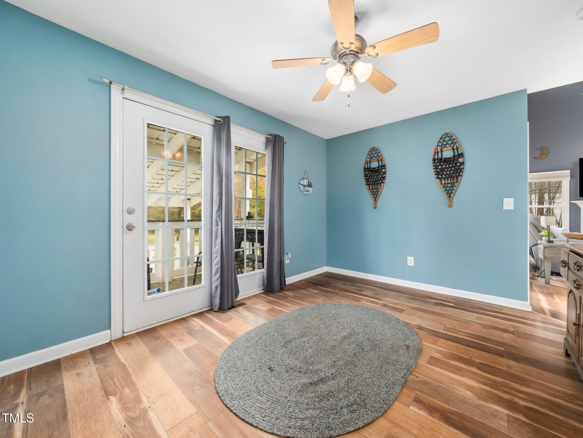 3690 Mabel Lane Stem, NC 27581 - Photo 14 of 37 an empty room with fan and windows