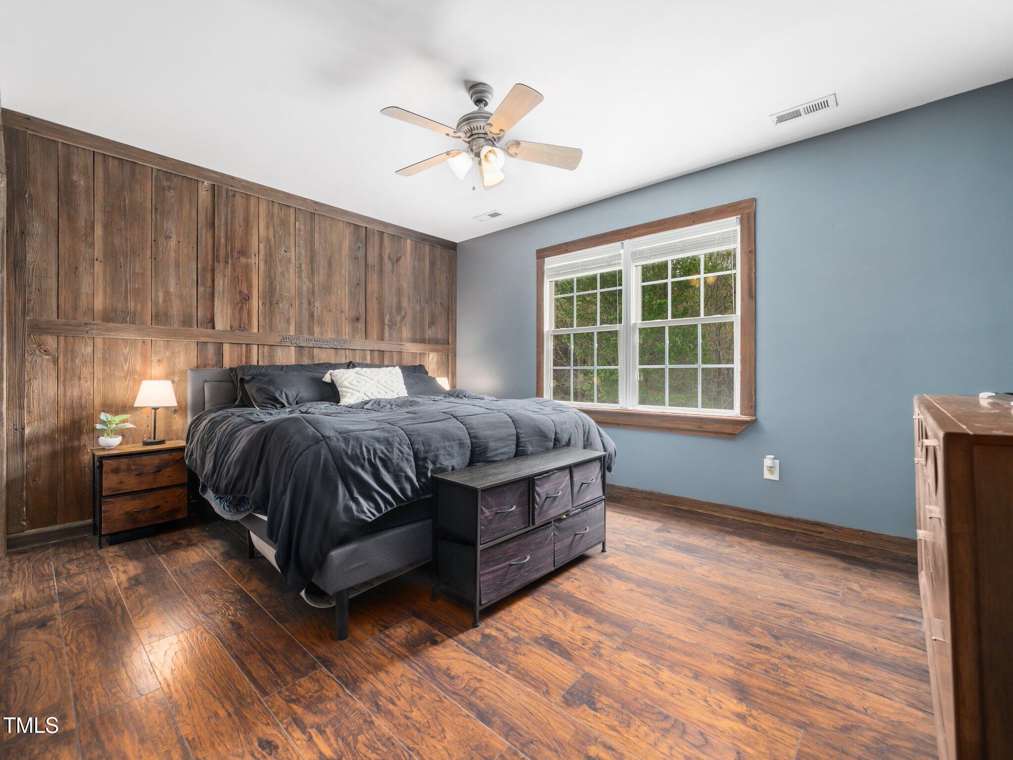 3690 Mabel Lane Stem, NC 27581 - Photo 16 of 37 a bedroom with a bed and window