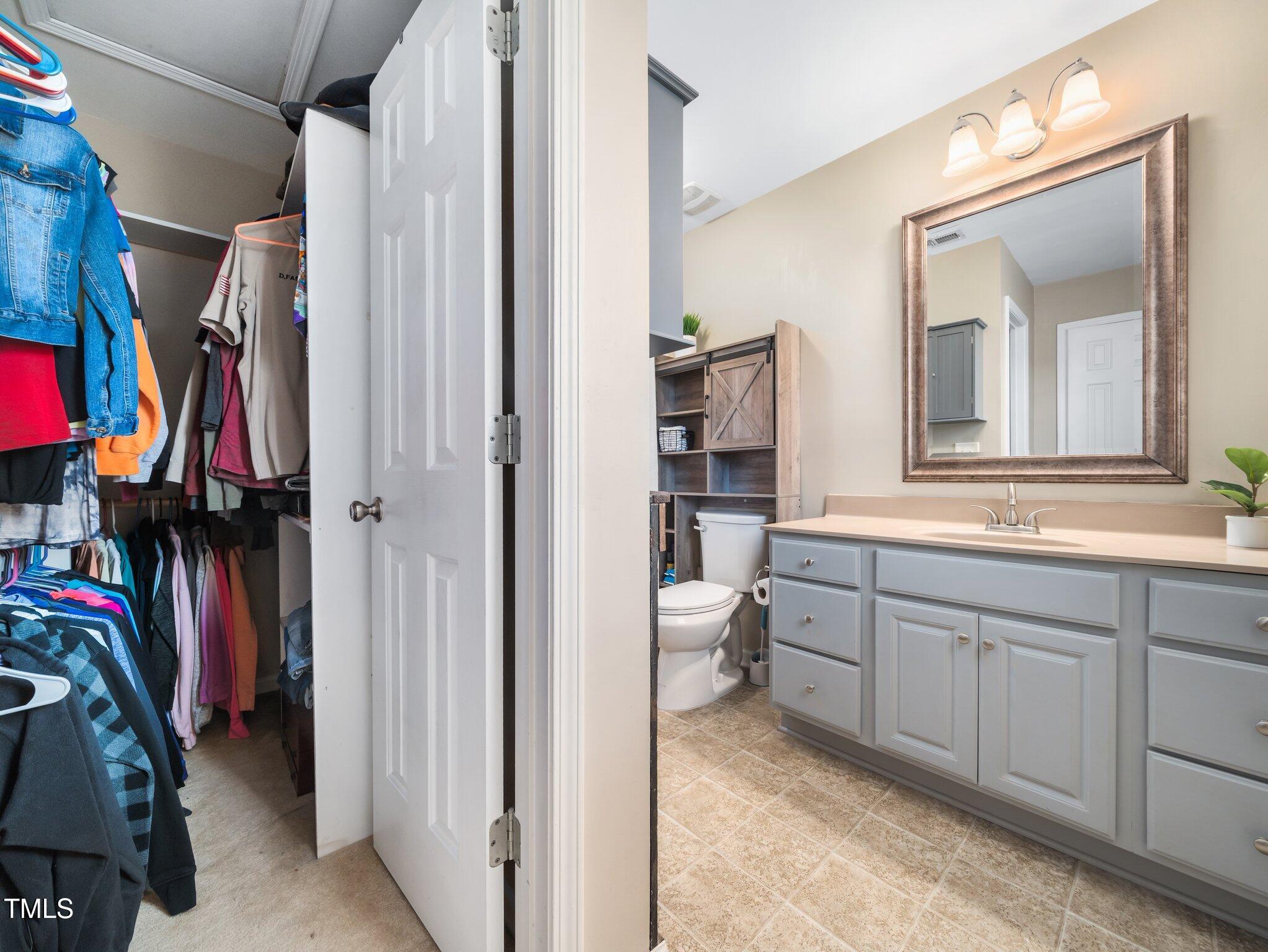 3690 Mabel Lane Stem, NC 27581 - Photo 19 of 37 a bathroom with a sink vanity and a mirror