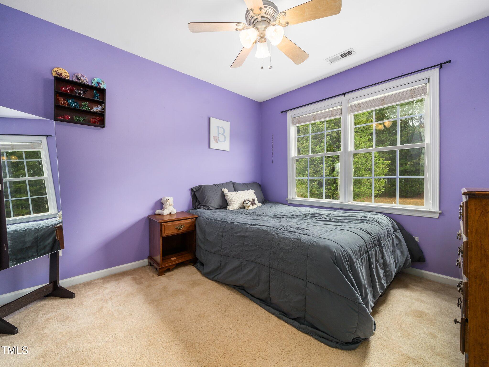3690 Mabel Lane Stem, NC 27581 - Photo 20 of 37 a bed room with a bed and a window