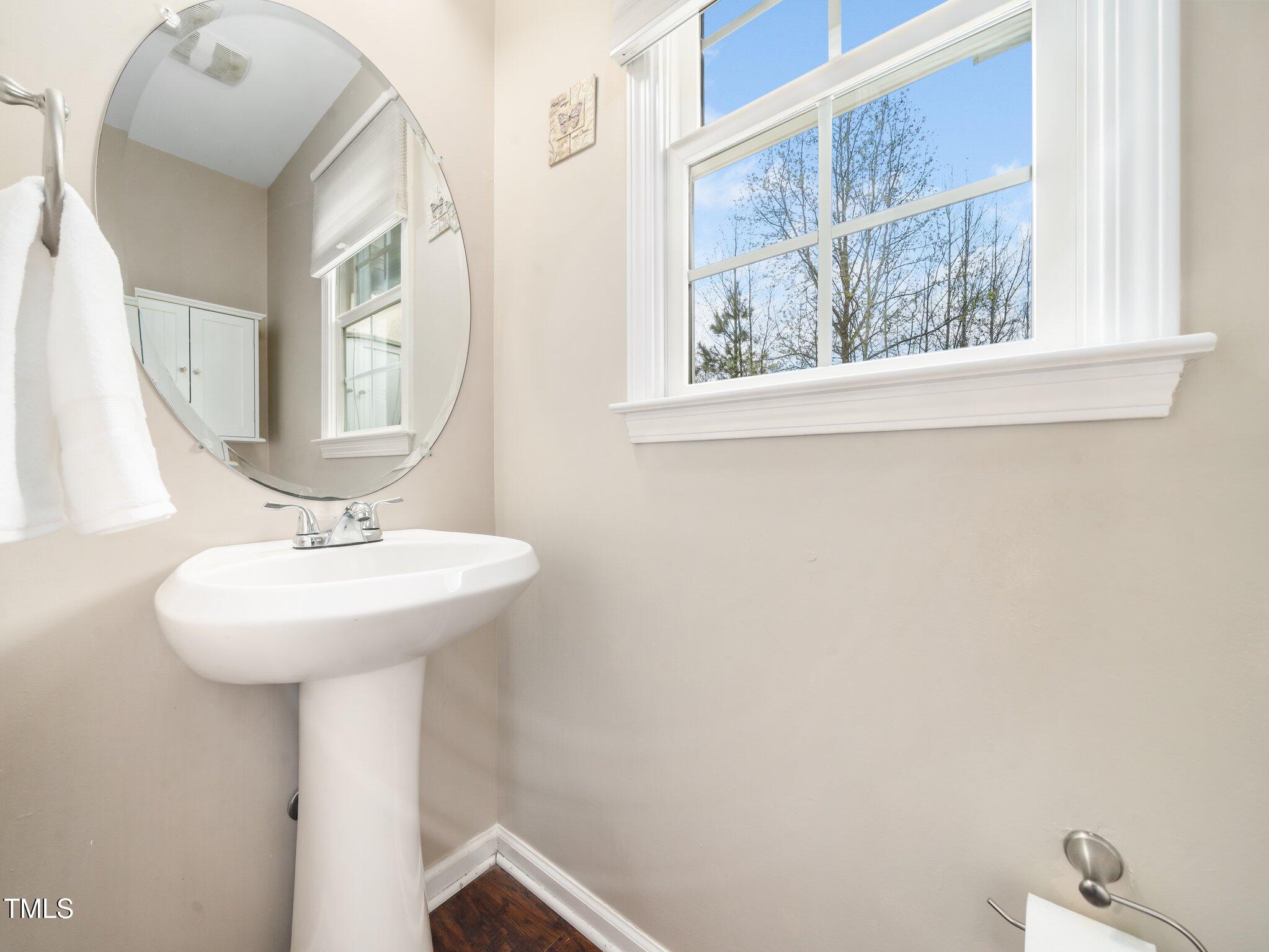 3690 Mabel Lane Stem, NC 27581 - Photo 23 of 37 a bathroom with a sink and a mirror