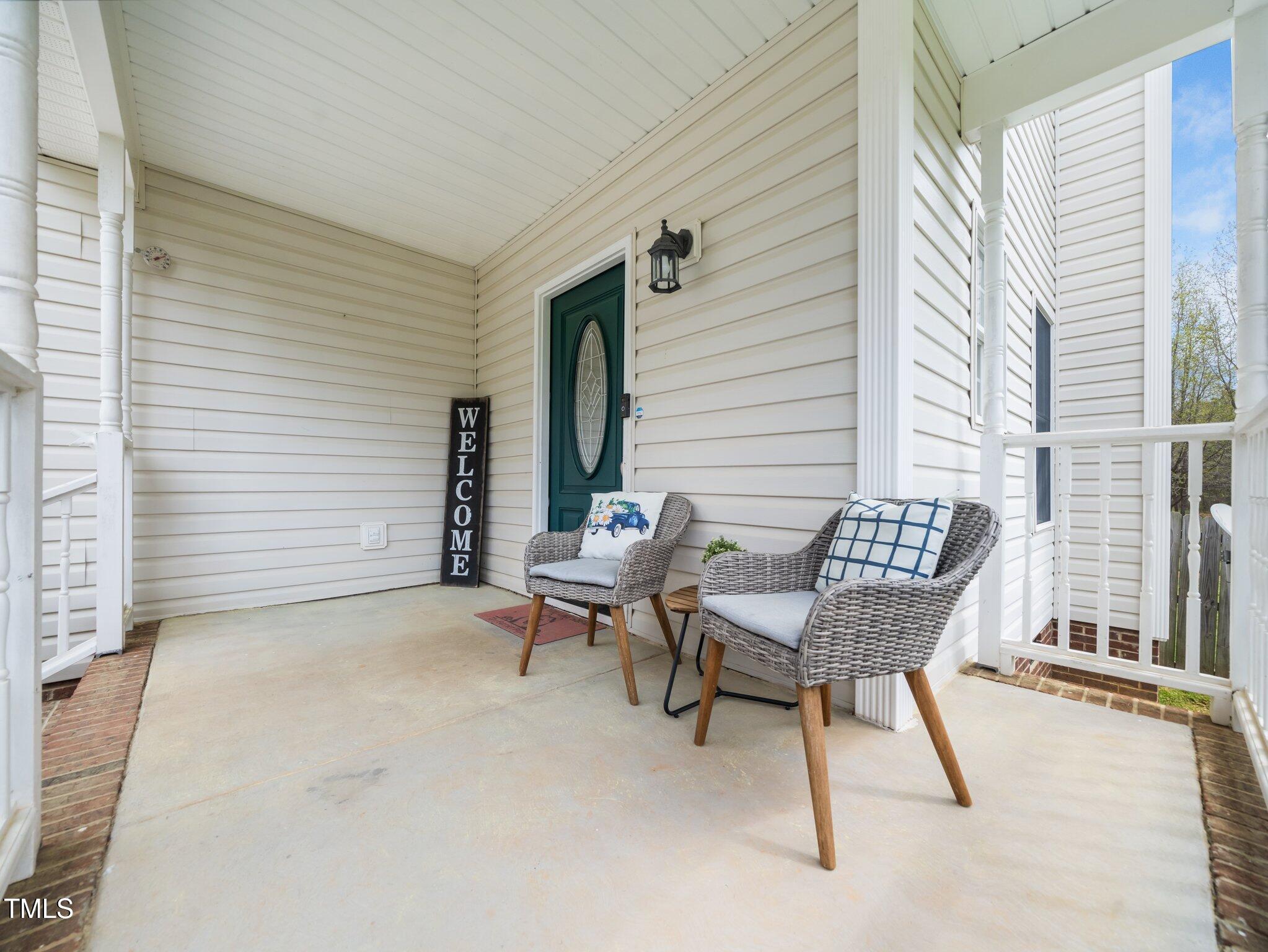 3690 Mabel Lane Stem, NC 27581 - Photo 25 of 37 a chairs and a table in a balcony
