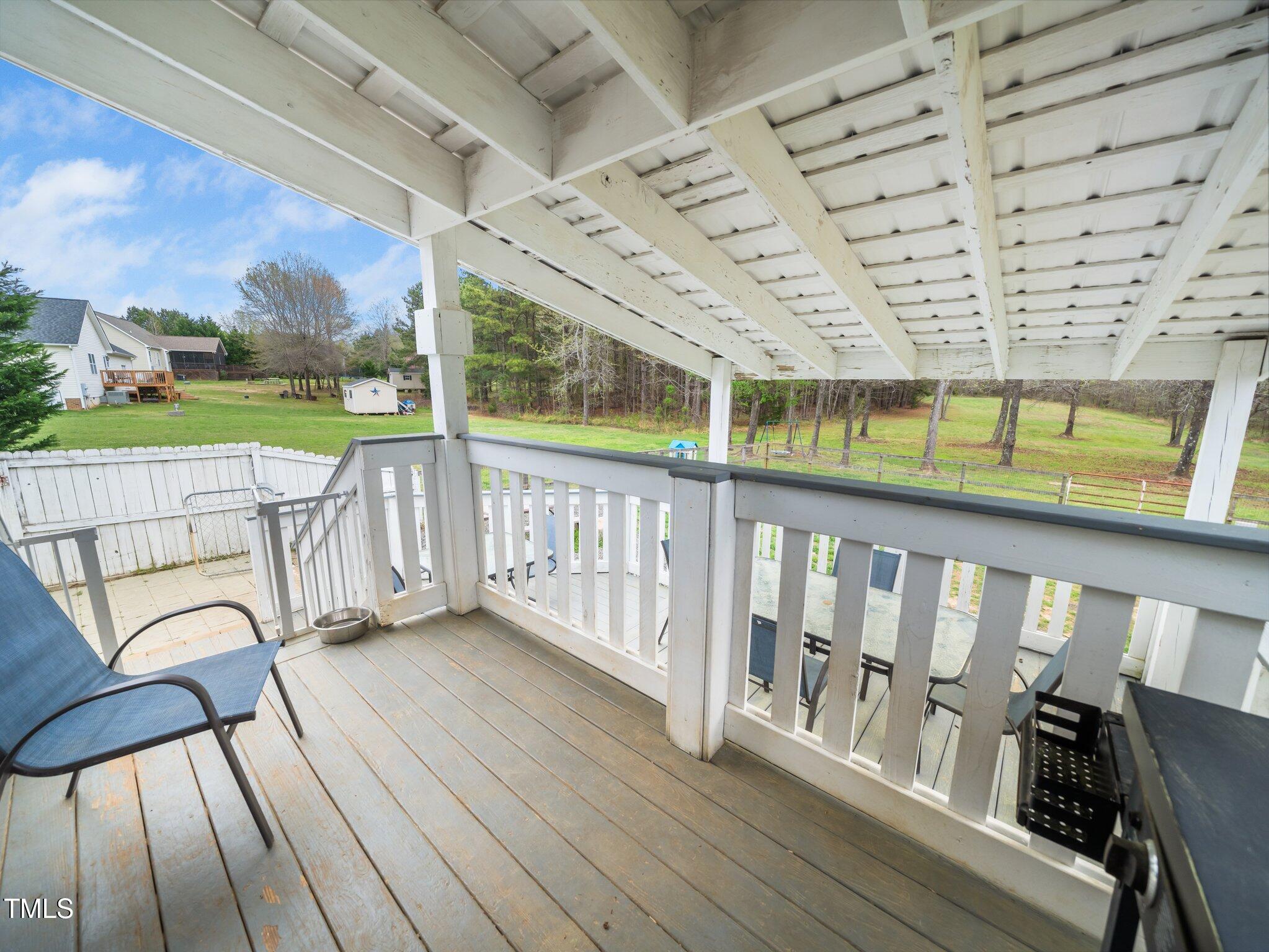 3690 Mabel Lane Stem, NC 27581 - Photo 28 of 37 a view of a balcony with wooden floor