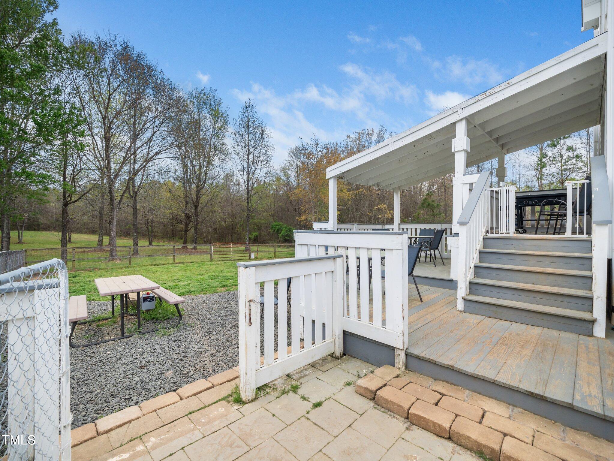 3690 Mabel Lane Stem, NC 27581 - Photo 29 of 37 a view of a house with backyard and a garden