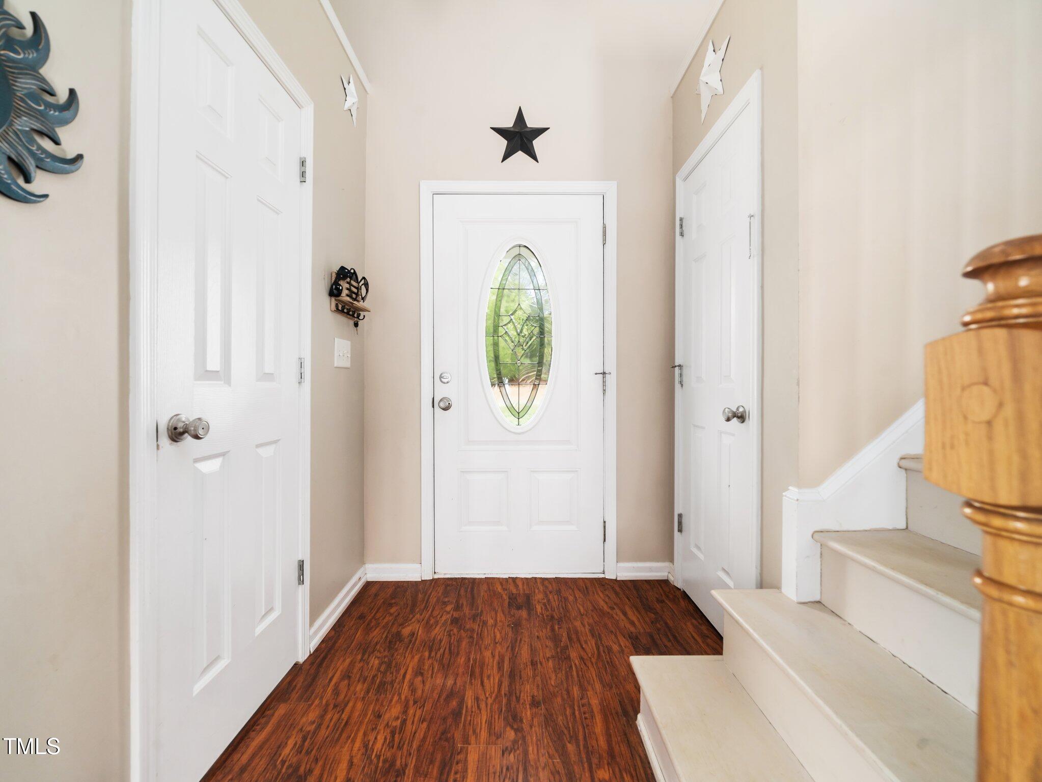 3690 Mabel Lane Stem, NC 27581 - Photo 3 of 37 a view of a hallway view with wooden floor and staircase