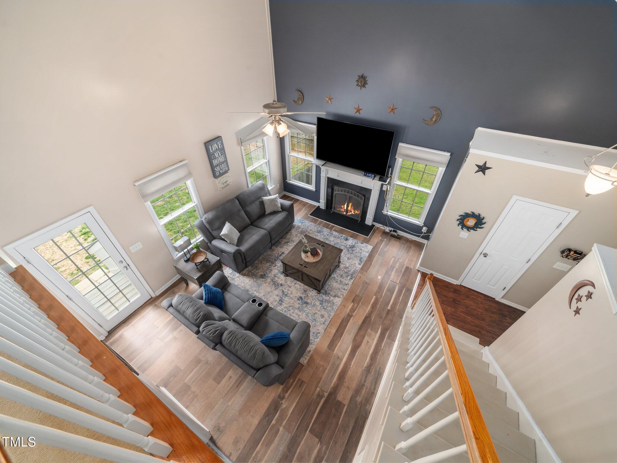 3690 Mabel Lane Stem, NC 27581 - Photo 8 of 37 a living room with furniture and a flat screen tv