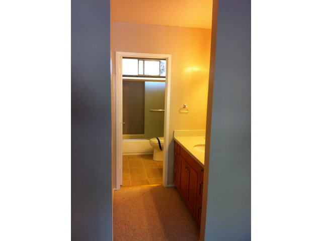 1231 Terra Nova Boulevard Pacifica, CA 94044 - Photo 12 of 18 a view of a hallway with a large window and a bathroom