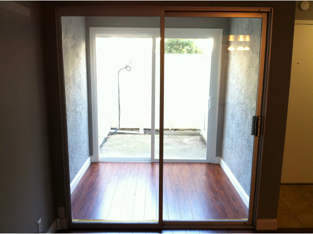 1231 Terra Nova Boulevard Pacifica, CA 94044 - Photo 8 of 18 a view of a glass door with wooden floor