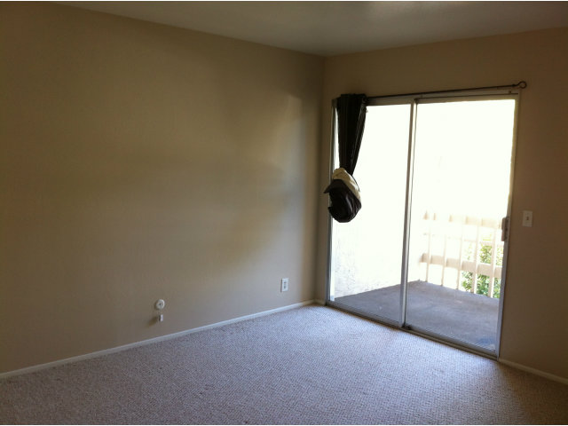 1231 Terra Nova Boulevard Pacifica, CA 94044 - Photo 10 of 18 a view of empty room with wooden floor and fan