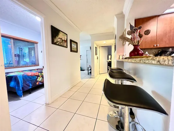 a room with furniture and a potted plant