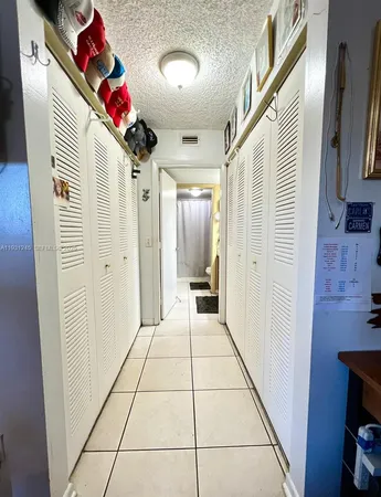 a view of a hallway and interior of the house