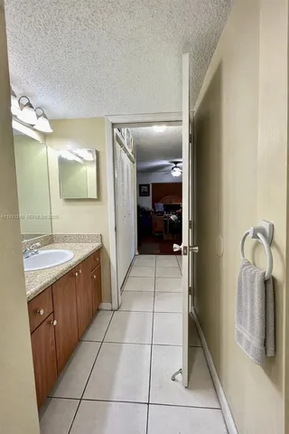 a bathroom with a sink a mirror and a shower