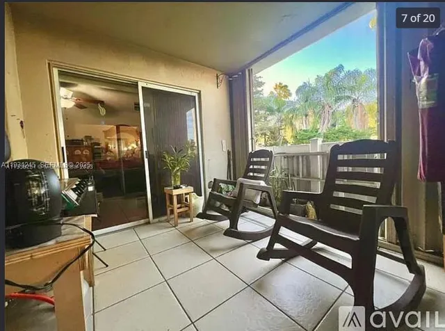 a view of a hallway with seating area