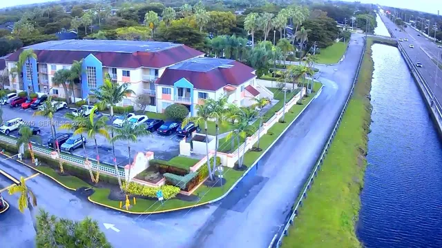 a view of a backyard with sitting area