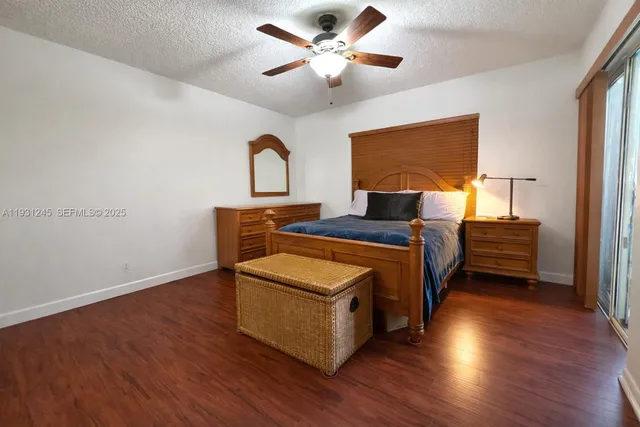 a bedroom with furniture and wooden floor