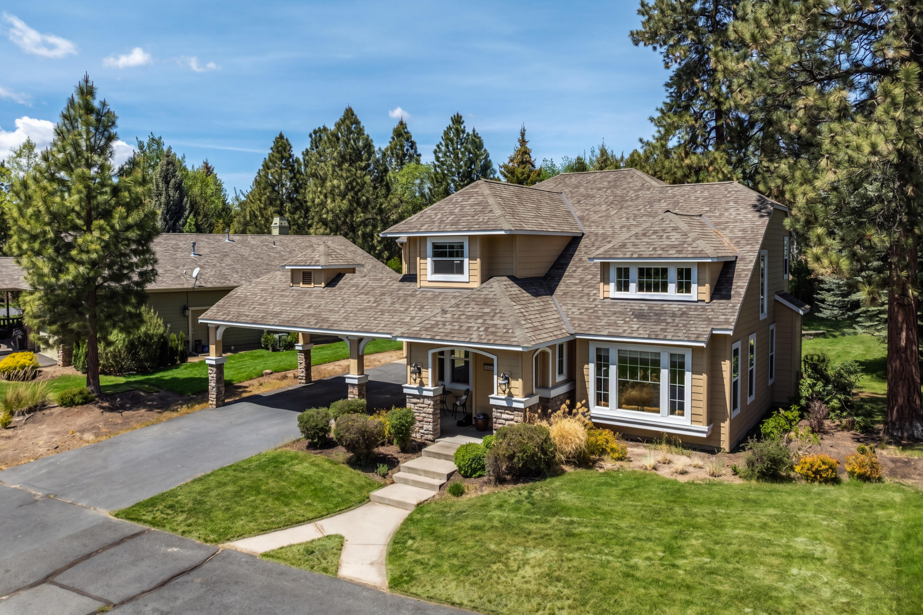19307 Blue Lake Loop Bend, OR 97702 - Photo 51 of 58 a aerial view of a house with a yard table and chairs