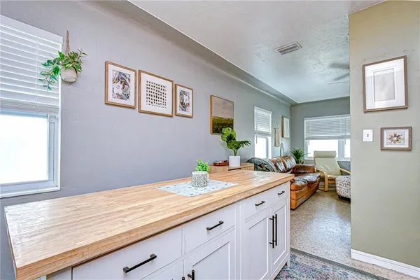 a kitchen with stainless steel appliances granite countertop a refrigerator sink and cabinets