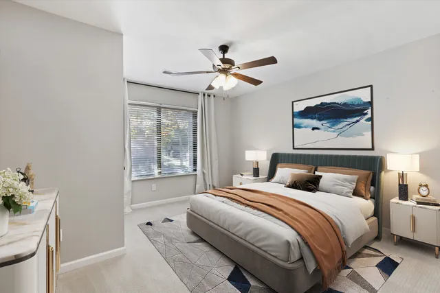 a bedroom with a bed and a window