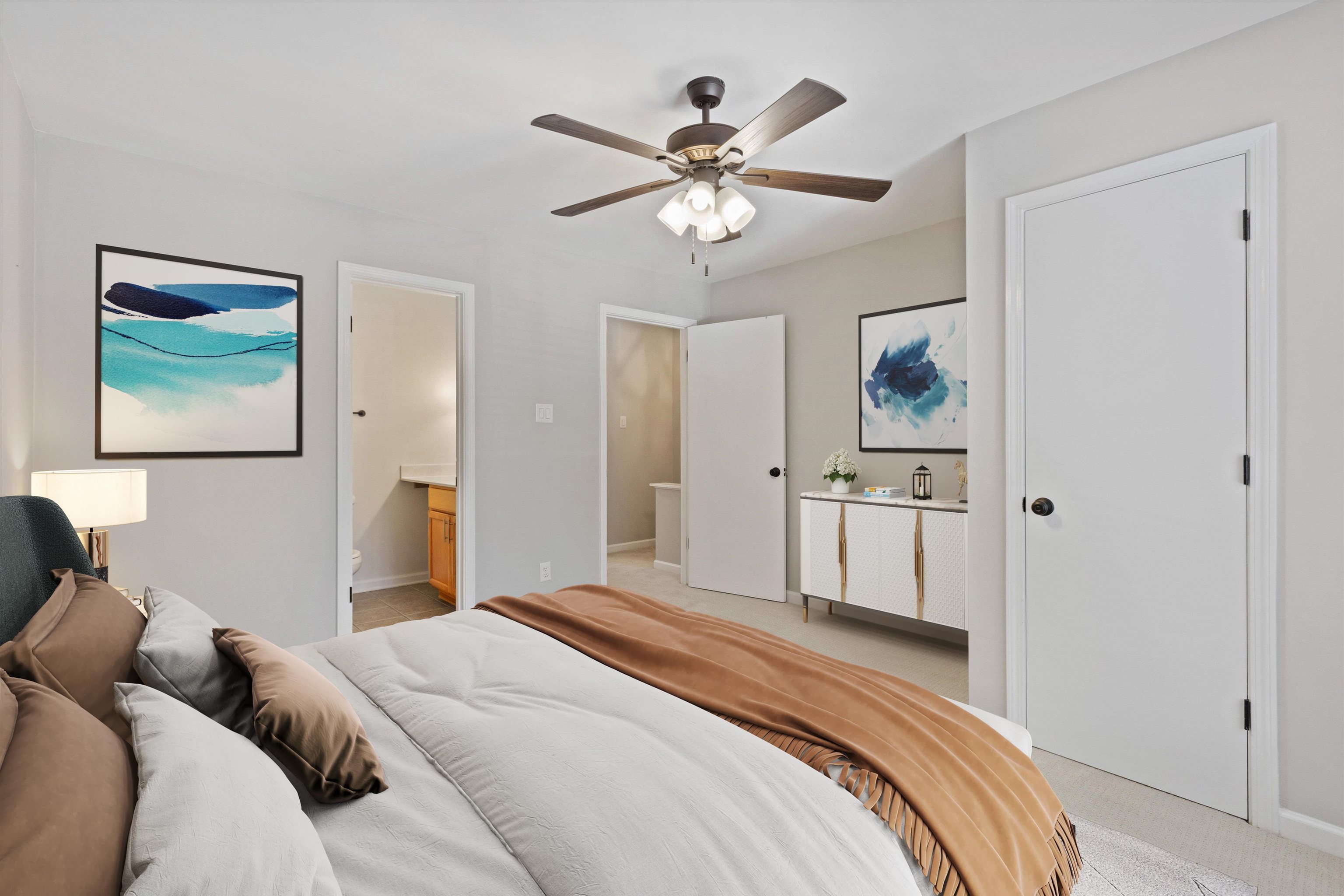 1806 Birch Post Cove, Unit 118 Germantown, TN 38138 - Photo 12 of 25 a bedroom with a large bed and a chandelier