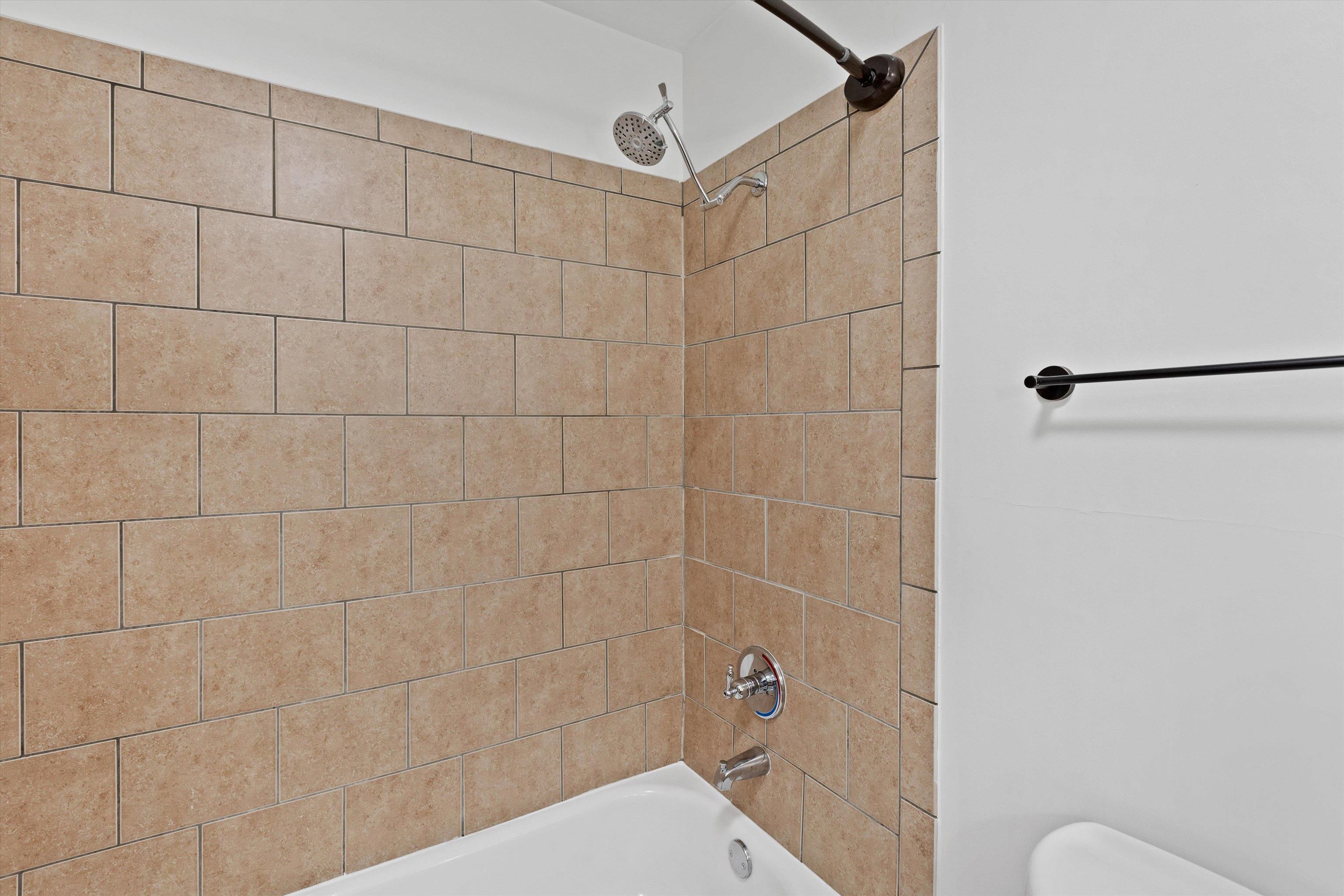 1806 Birch Post Cove, Unit 118 Germantown, TN 38138 - Photo 15 of 25 a bathroom with a shower and a toilet