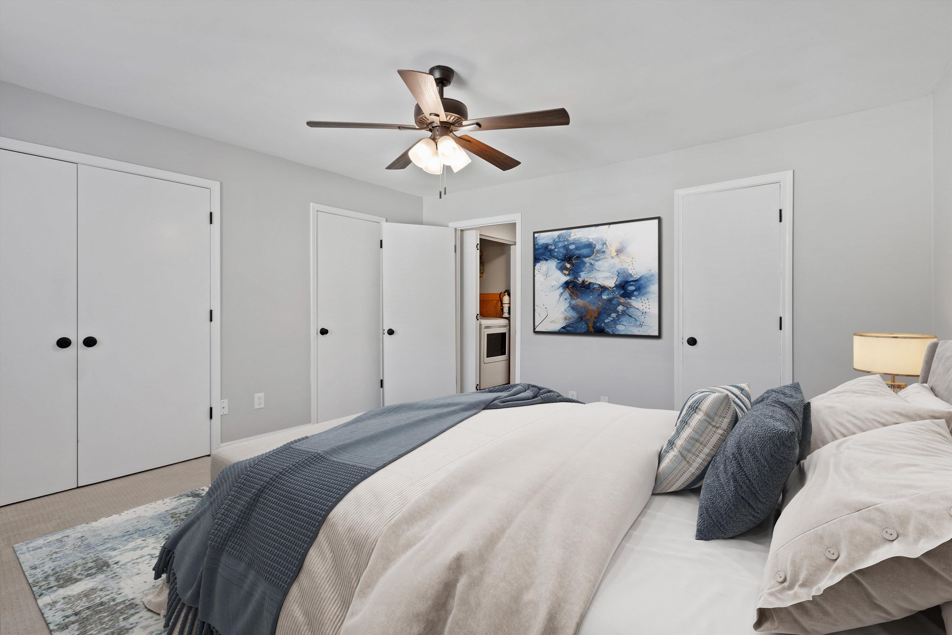 1806 Birch Post Cove, Unit 118 Germantown, TN 38138 - Photo 17 of 25 a bedroom with a large bed and a ceiling fan