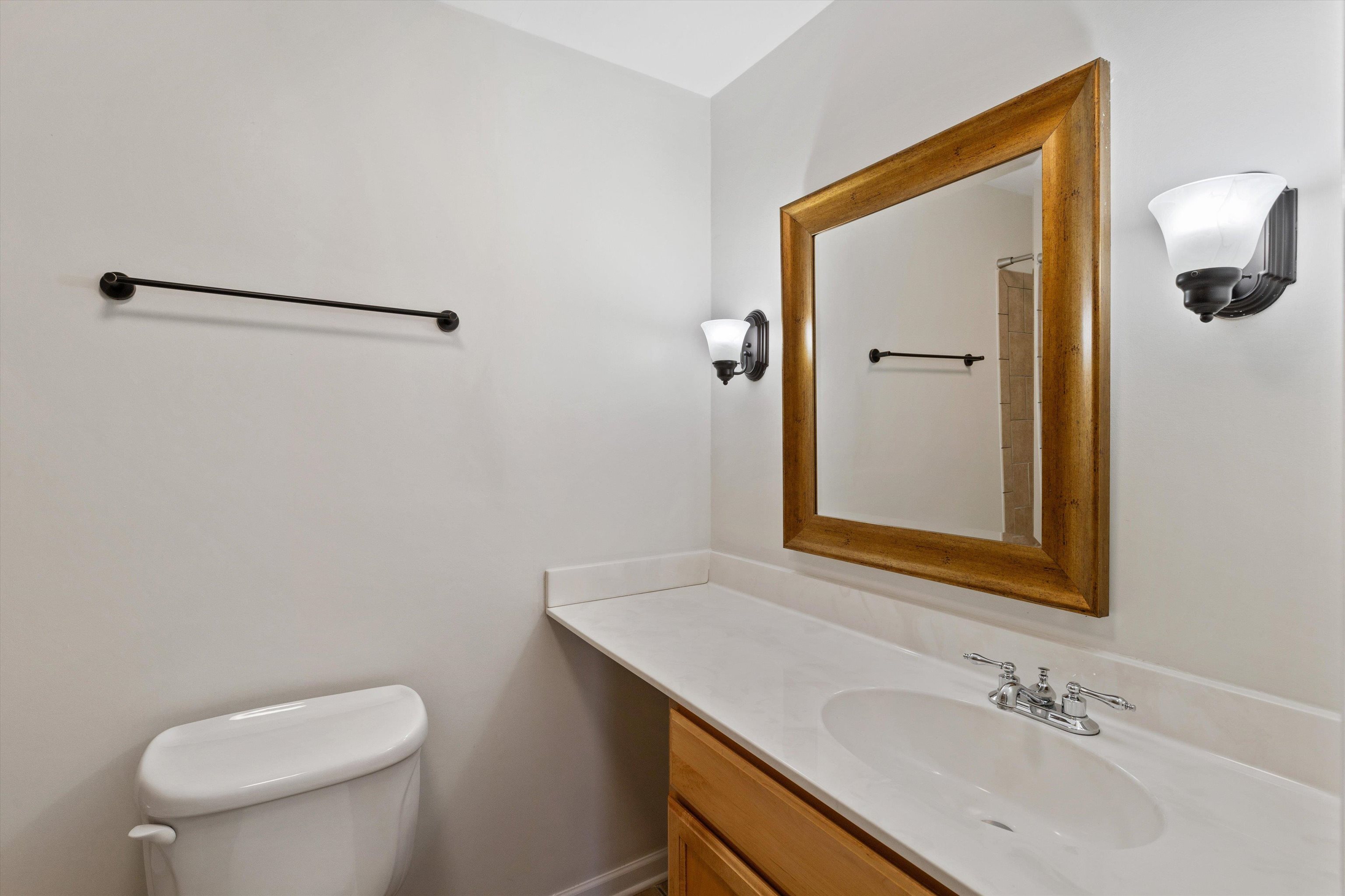 1806 Birch Post Cove, Unit 118 Germantown, TN 38138 - Photo 18 of 25 a bathroom with a sink a toilet and mirror