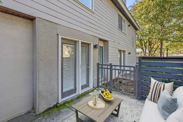 a view of a deck with couches and wooden floor