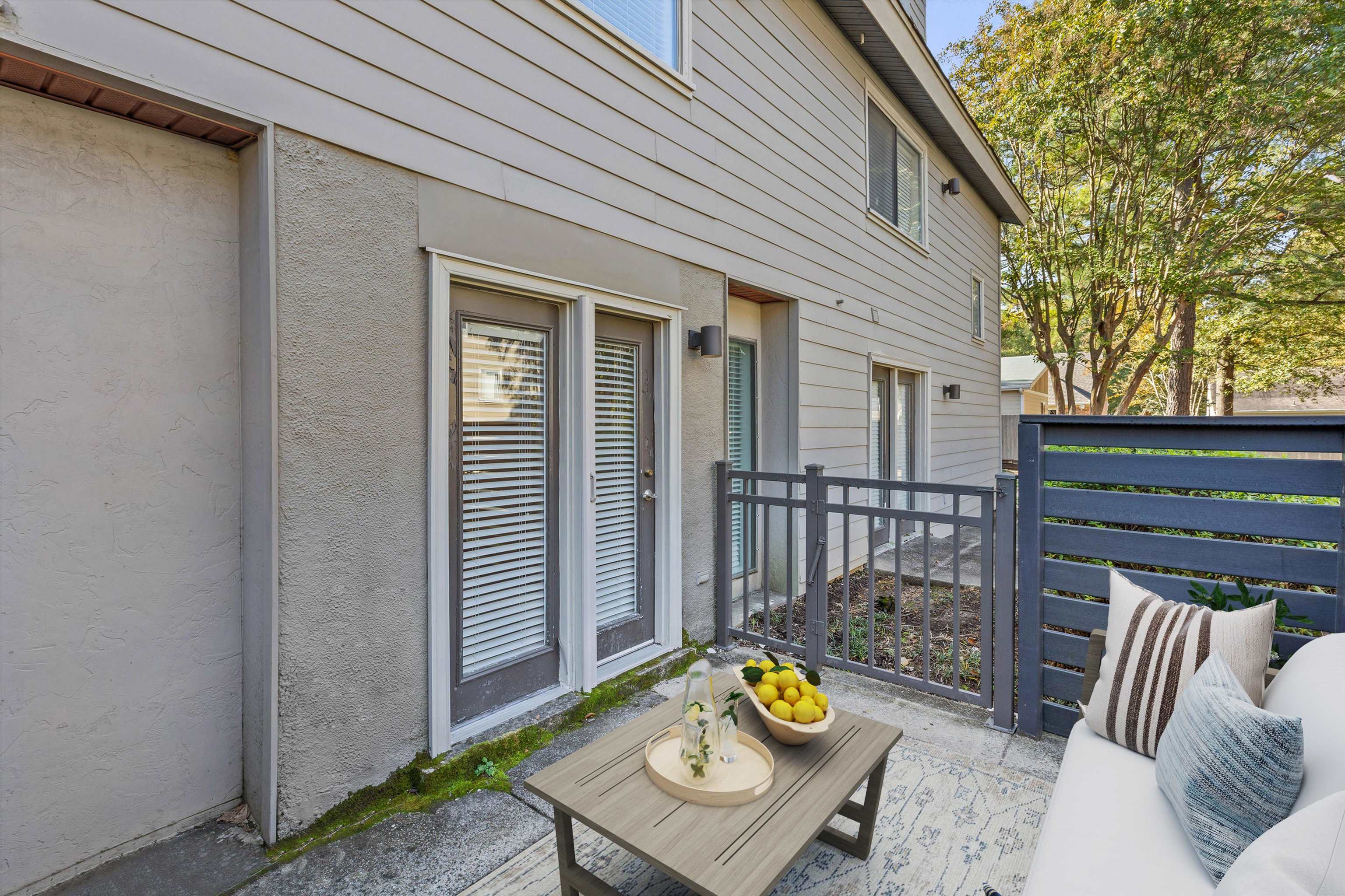 1806 Birch Post Cove, Unit 118 Germantown, TN 38138 - Photo 22 of 25 a view of a deck with couches and wooden floor