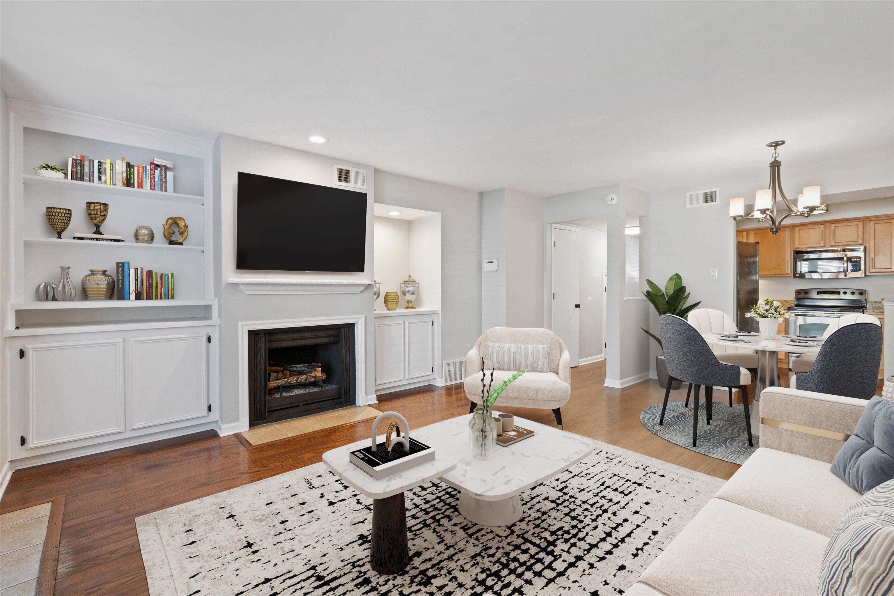 1806 Birch Post Cove, Unit 118 Germantown, TN 38138 - Photo 9 of 25 a living room with furniture a fireplace and a flat screen tv