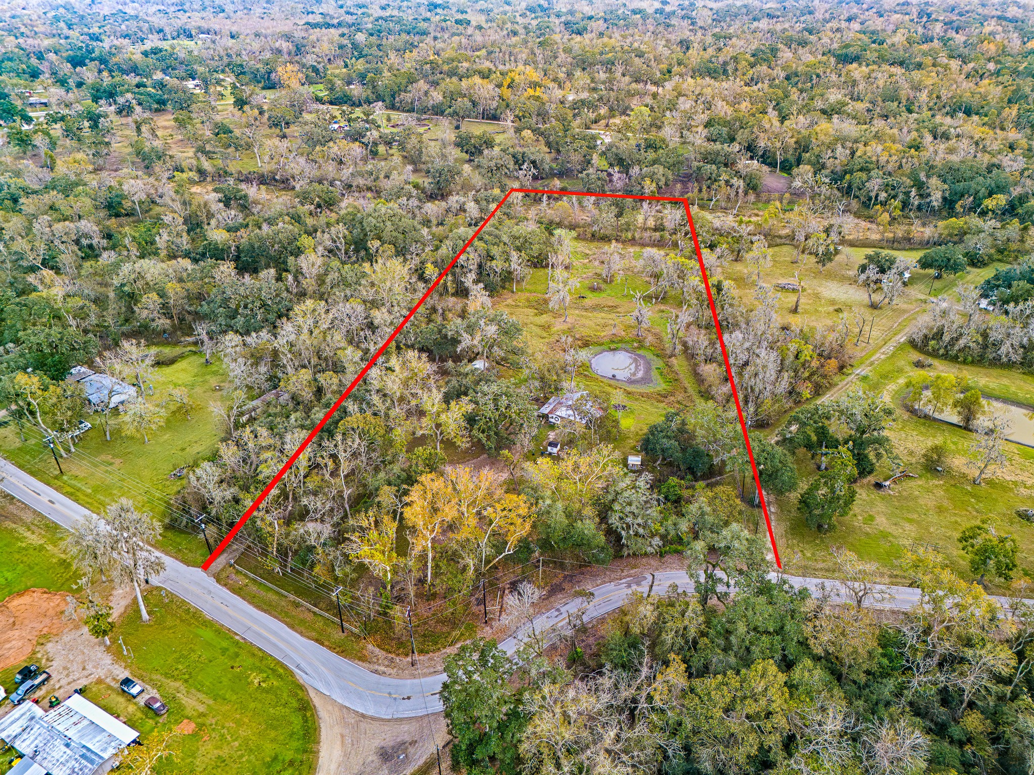 209 River Road Angleton, TX 77515 - Photo 2 of 38 an aerial view of residential houses with outdoor space