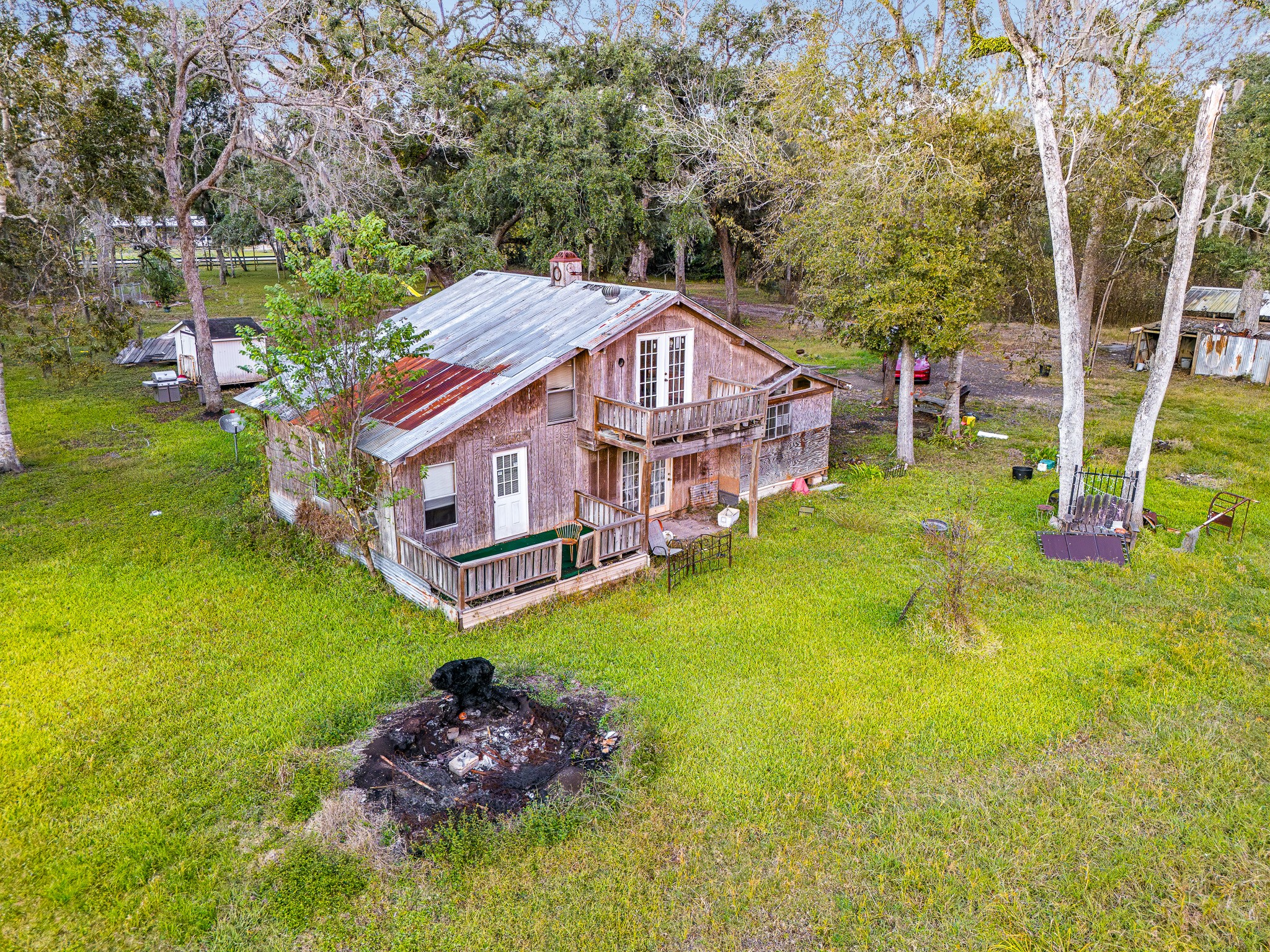 209 River Road Angleton, TX 77515 - Photo 26 of 38 a aerial view of a house with swimming pool big yard and large trees