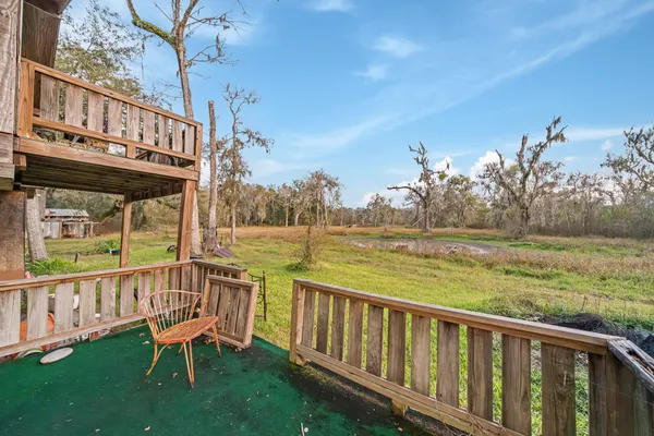 a view of a two chairs and table in the deck