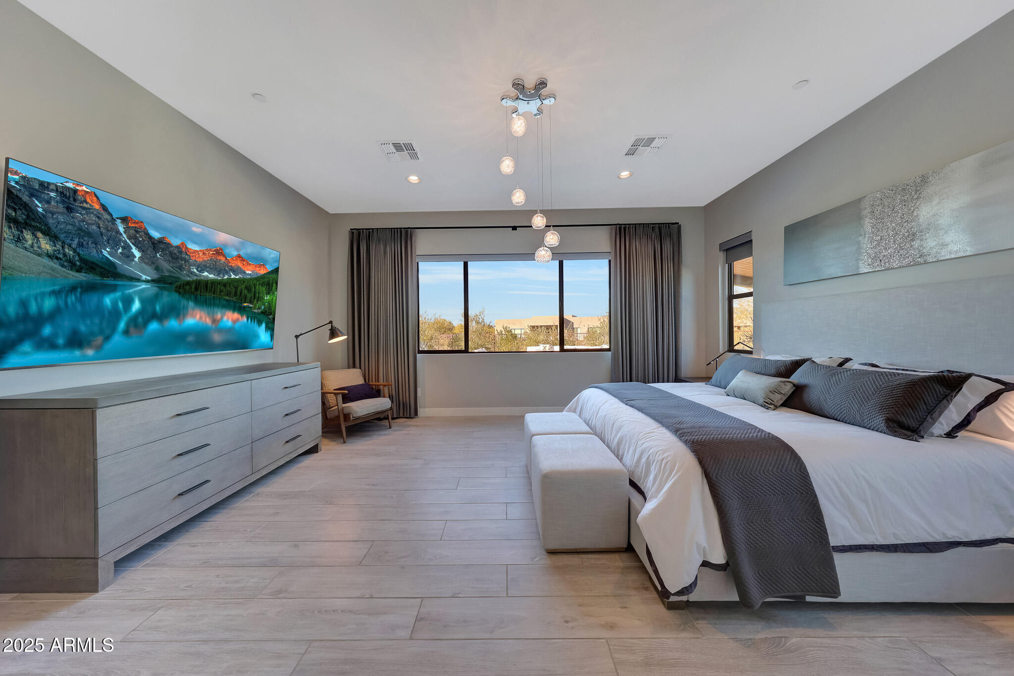 13018 East Juan Tabo Road Scottsdale, AZ 85255 - Photo 21 of 72 a spacious bedroom with a large bed and a flat screen tv