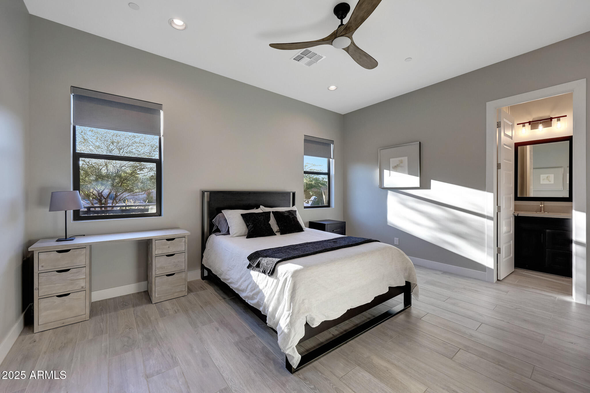 13018 East Juan Tabo Road Scottsdale, AZ 85255 - Photo 31 of 72 a bedroom with a large bed and a window