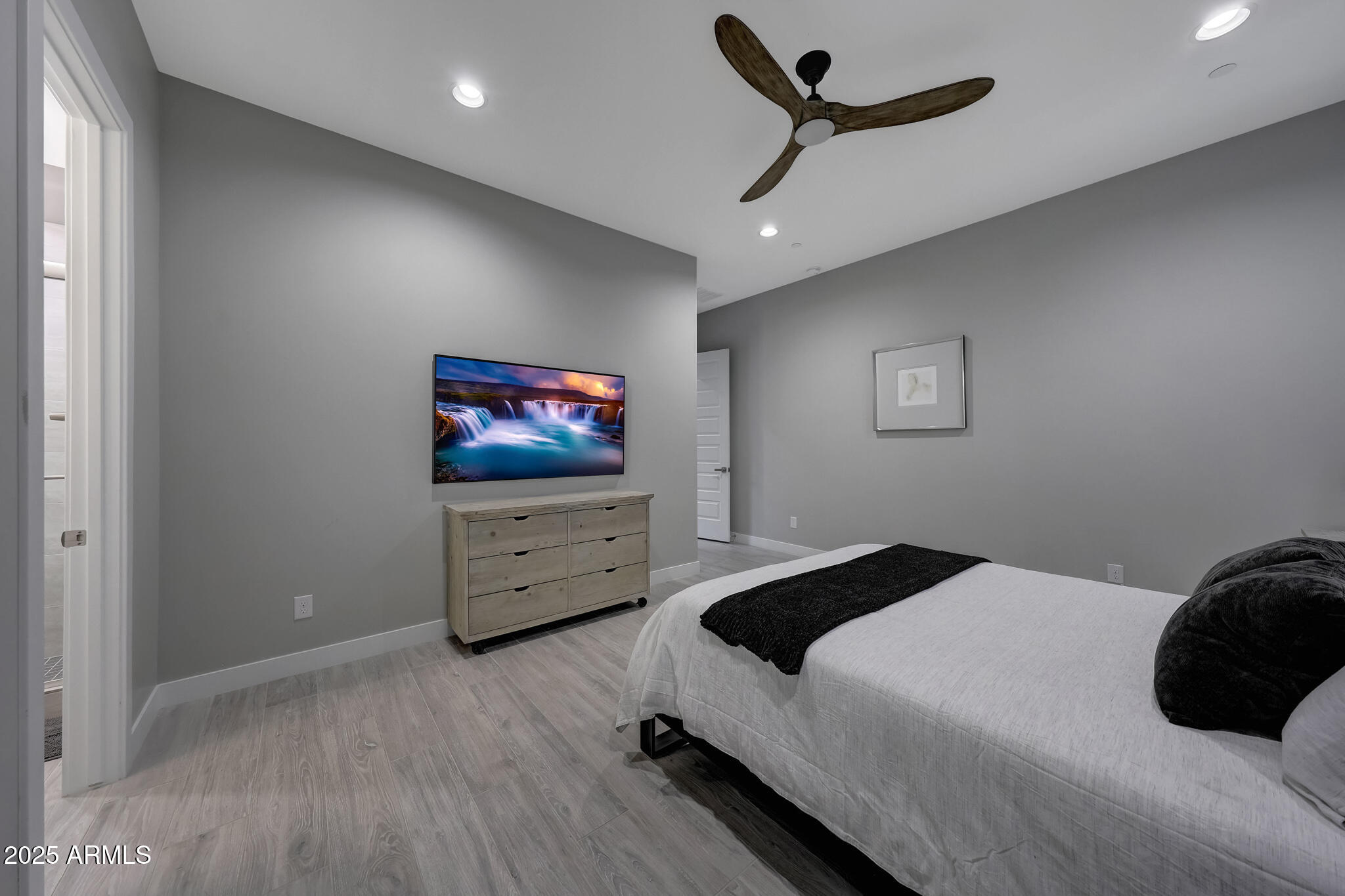 13018 East Juan Tabo Road Scottsdale, AZ 85255 - Photo 32 of 72 a bedroom with a bed and a flat screen tv
