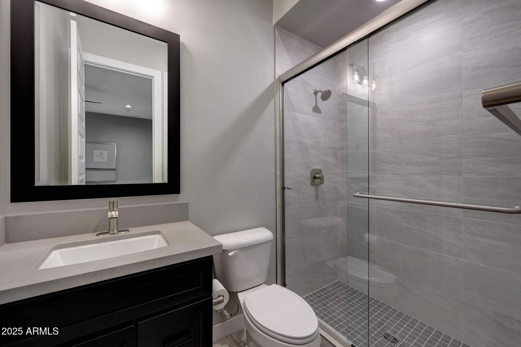13018 East Juan Tabo Road Scottsdale, AZ 85255 - Photo 33 of 72 a bathroom with a sink a toilet and shower