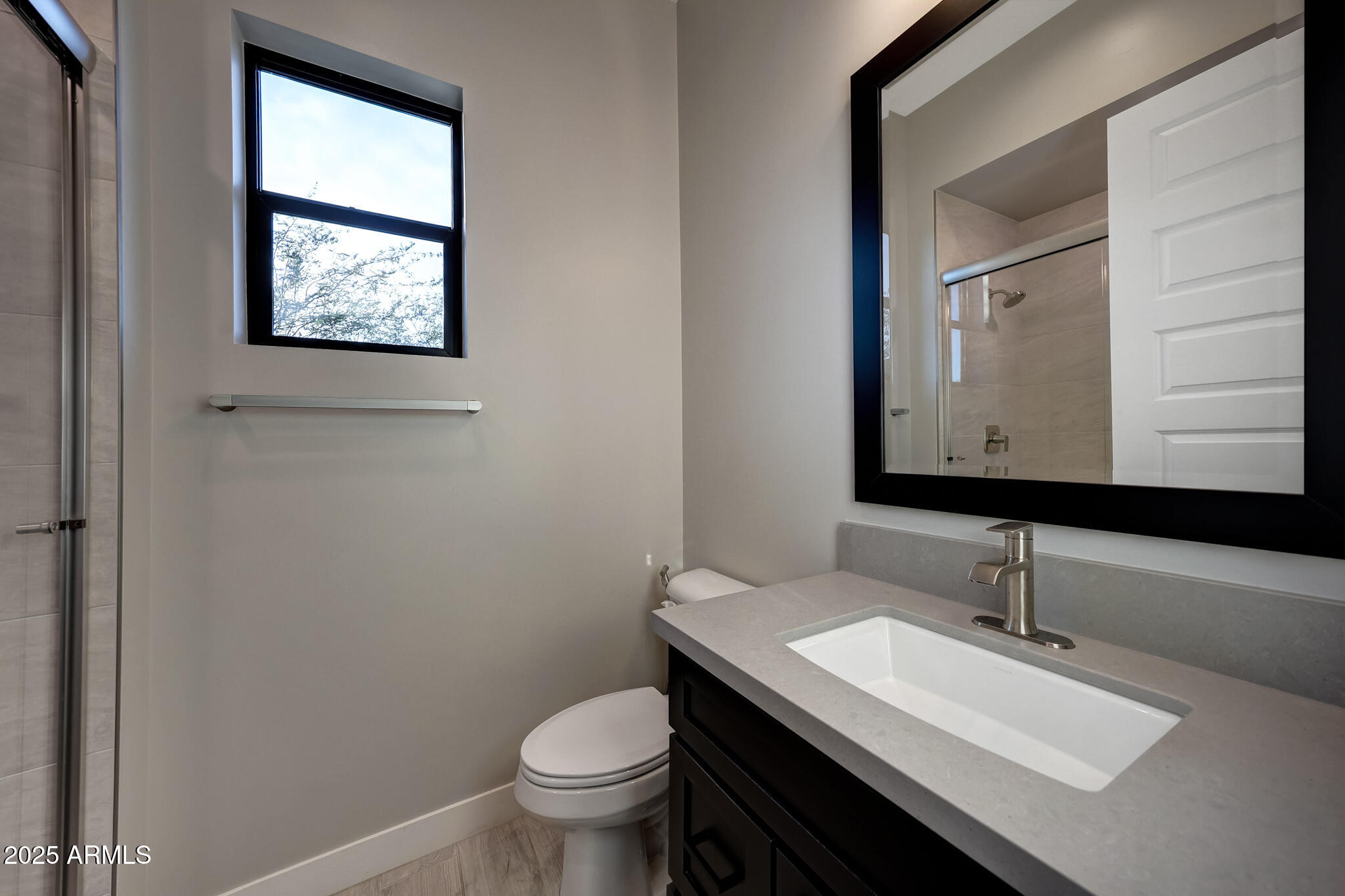13018 East Juan Tabo Road Scottsdale, AZ 85255 - Photo 35 of 72 a bathroom with a sink toilet and mirror