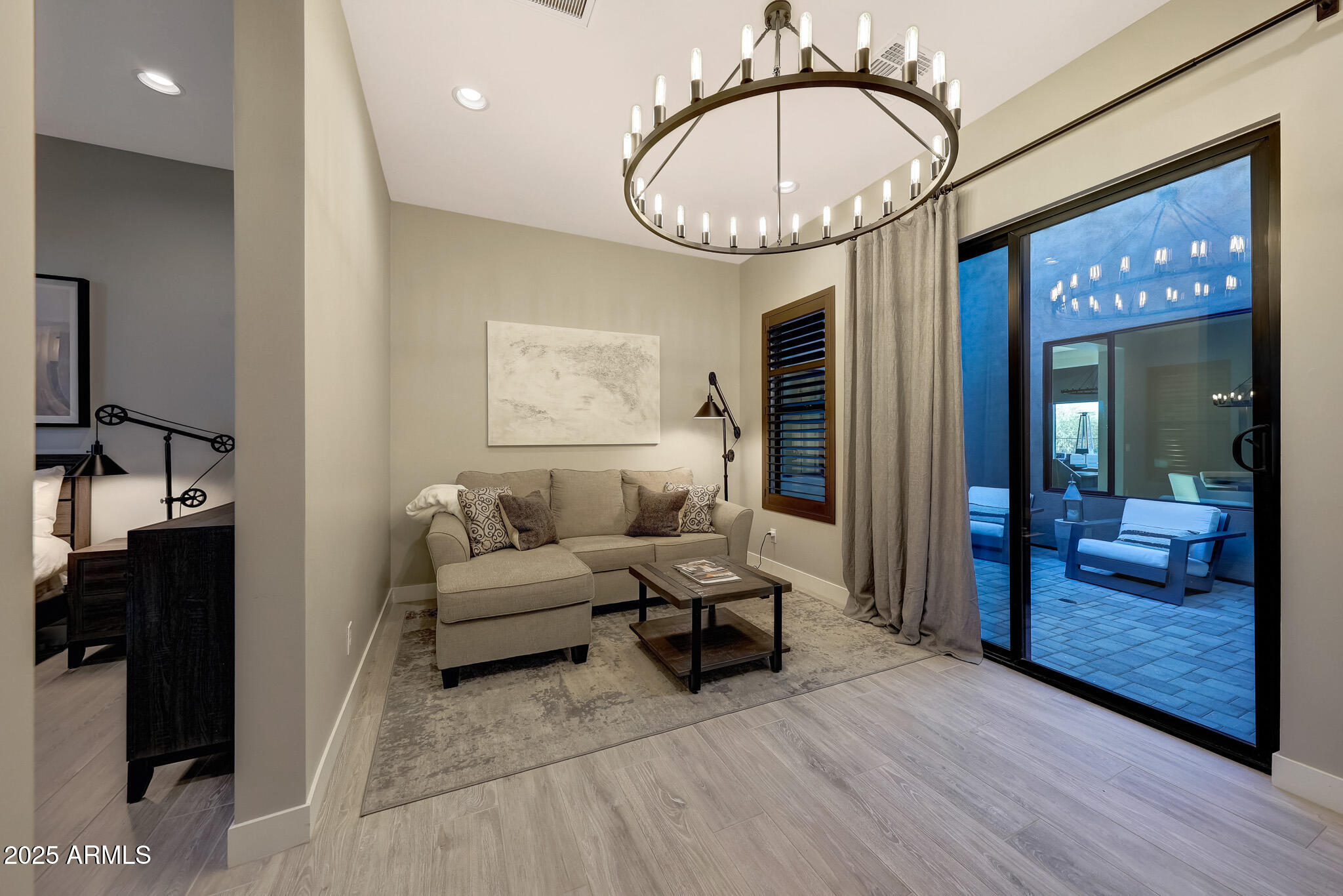 13018 East Juan Tabo Road Scottsdale, AZ 85255 - Photo 37 of 72 a living room with furniture a fireplace and a chandelier