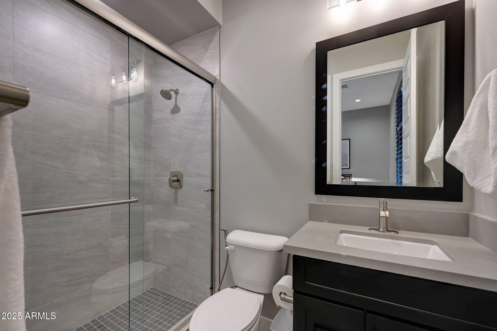 13018 East Juan Tabo Road Scottsdale, AZ 85255 - Photo 40 of 72 a bathroom with a sink a toilet and shower
