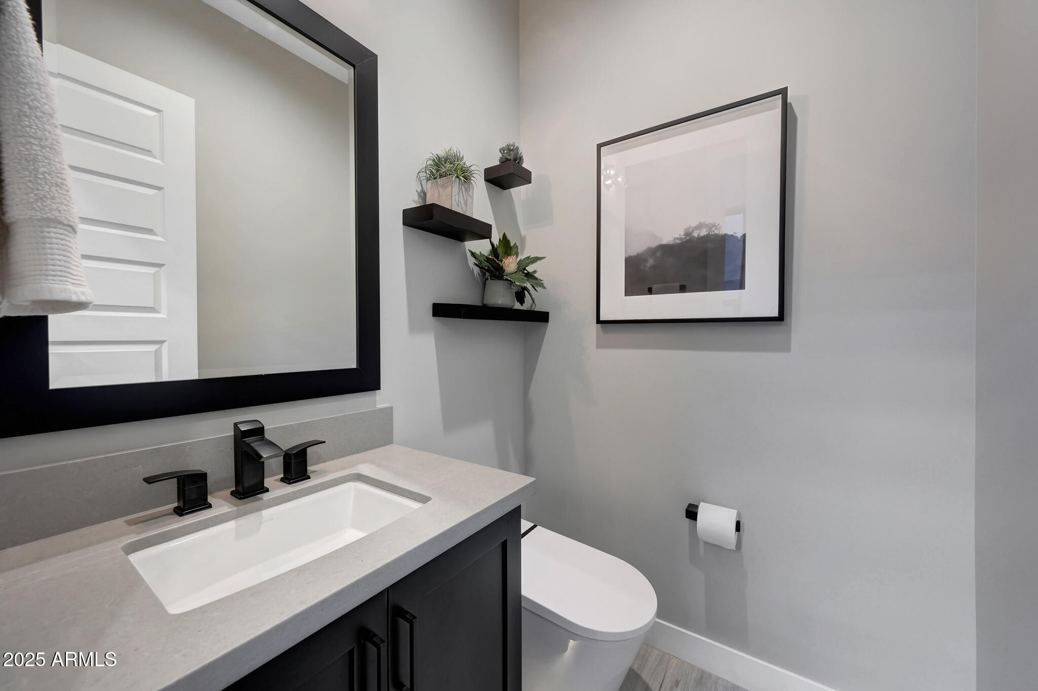 13018 East Juan Tabo Road Scottsdale, AZ 85255 - Photo 42 of 72 a bathroom with a toilet sink vanity and mirror