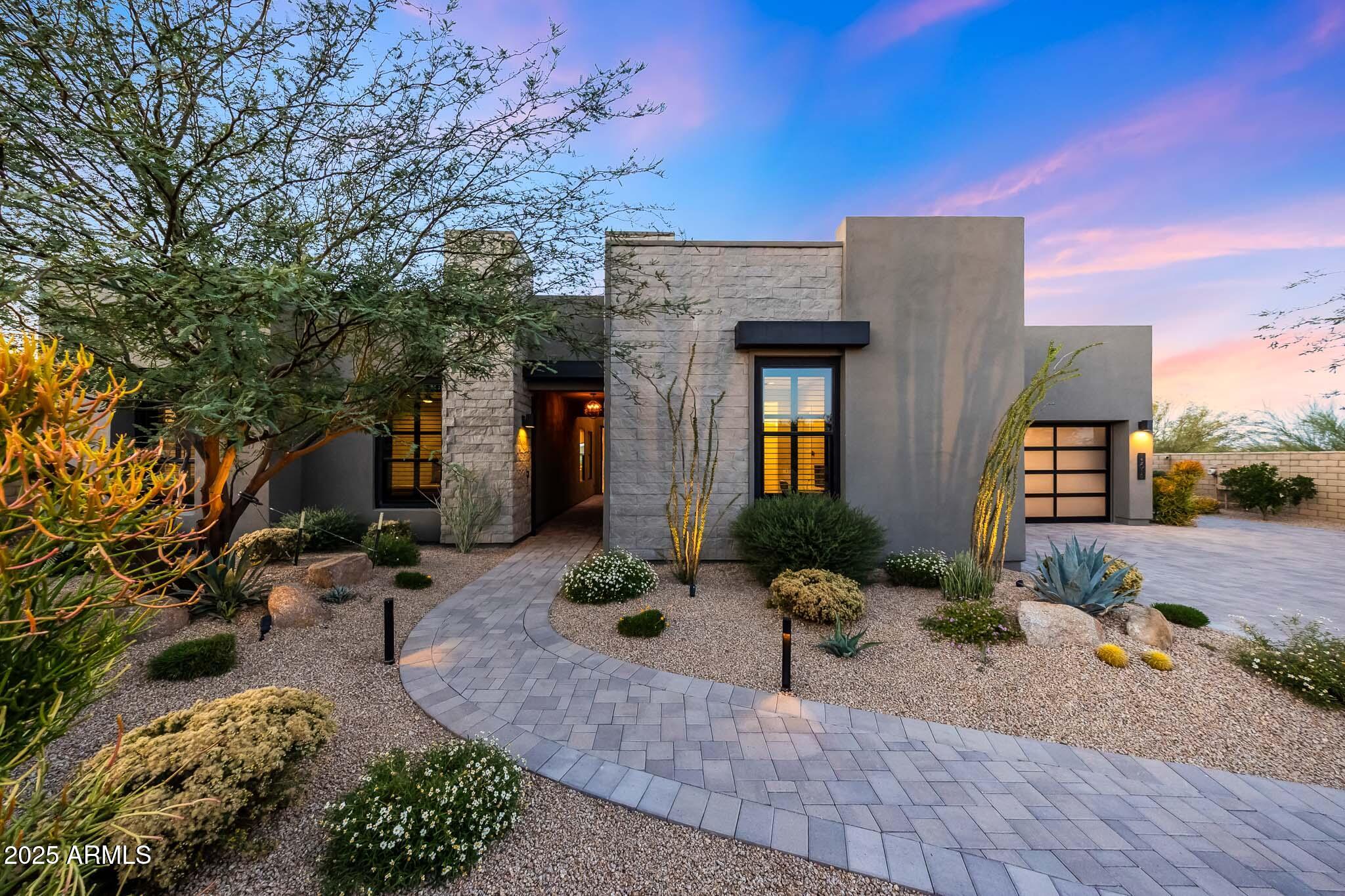 13018 East Juan Tabo Road Scottsdale, AZ 85255 - Photo 5 of 72 a front view of a house with a yard