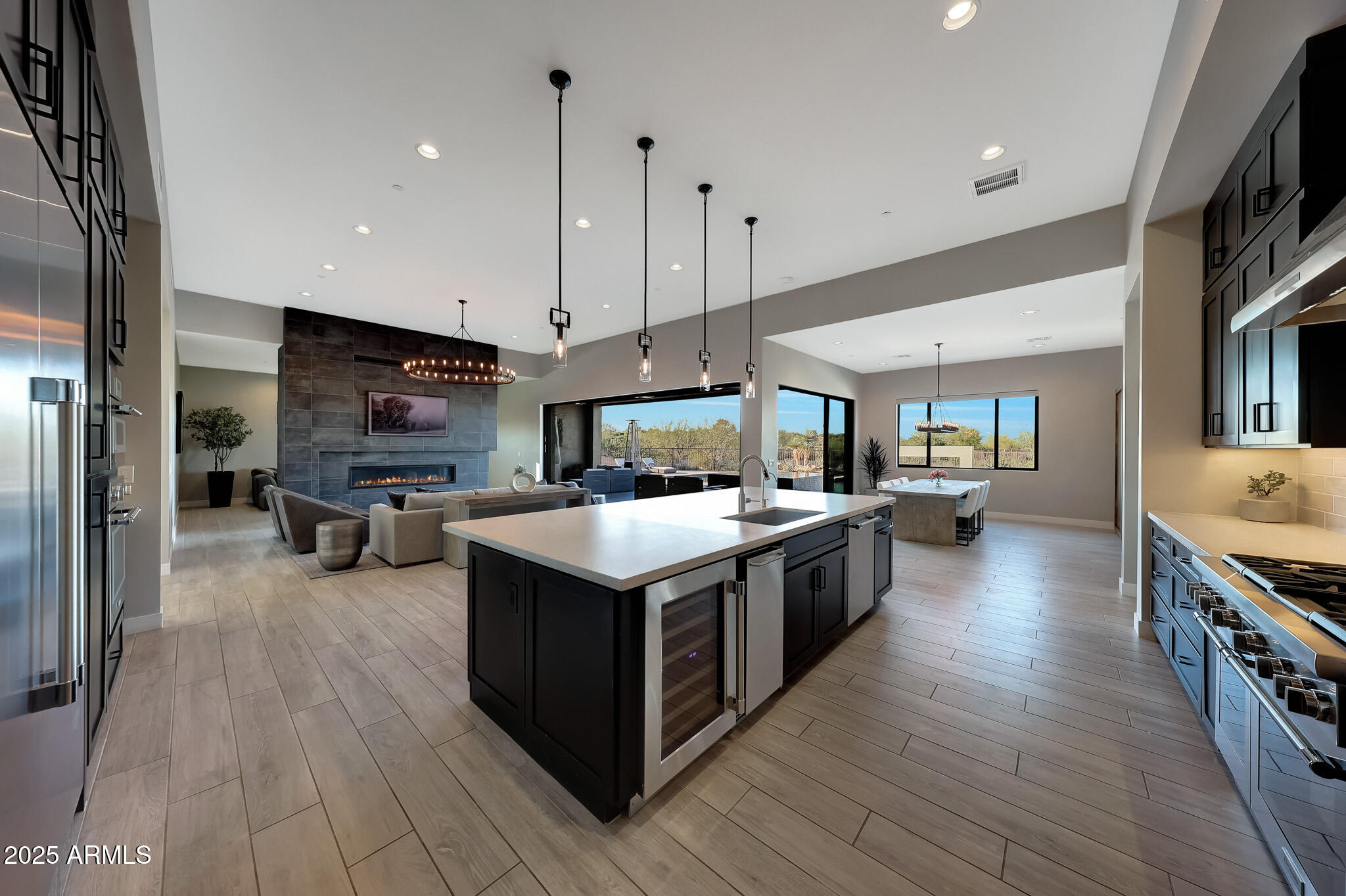 13018 East Juan Tabo Road Scottsdale, AZ 85255 - Photo 8 of 72 a kitchen with stainless steel appliances stove and wooden floor